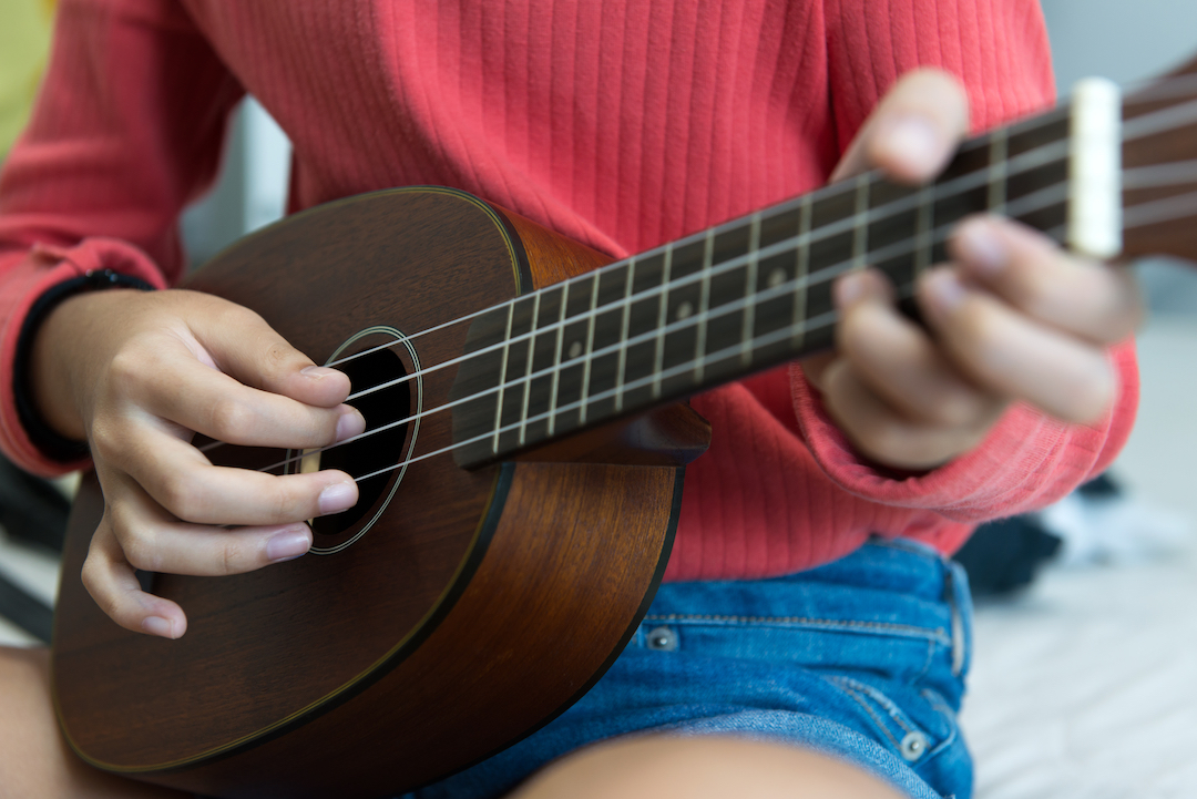 Ukulele being played during a lesson
